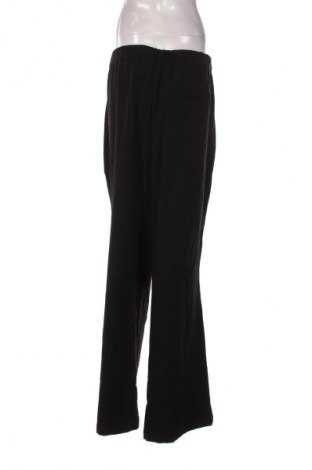 Dámské kalhoty  Guido Maria Kretschmer for About You, Velikost 3XL, Barva Černá, Cena  419,00 Kč