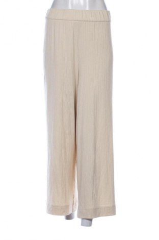 Damskie spodnie Monki, Rozmiar XL, Kolor Beżowy, Cena 29,99 zł
