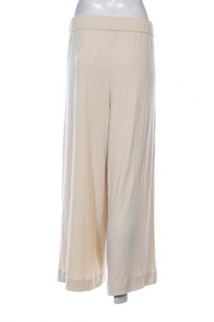 Damskie spodnie Monki, Rozmiar XL, Kolor Beżowy, Cena 29,99 zł