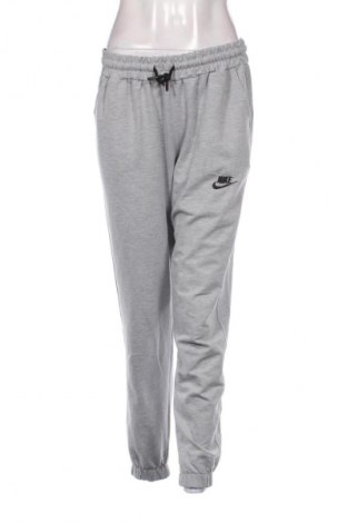 Dámské tepláky Nike, Velikost L, Barva Šedá, Cena  986,00 Kč