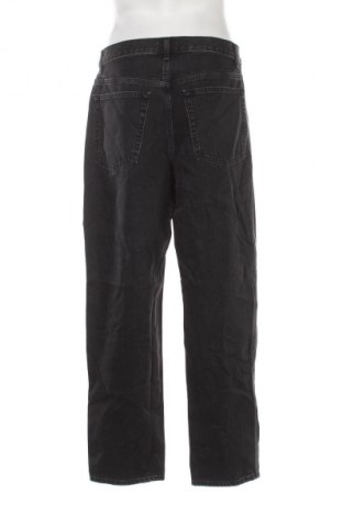 Męskie jeansy Uniqlo, Rozmiar L, Kolor Czarny, Cena 117,99 zł