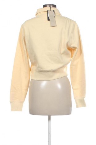 Γυναικεία μπλούζα Tommy Jeans, Μέγεθος L, Χρώμα Κίτρινο, Τιμή 47,99 €