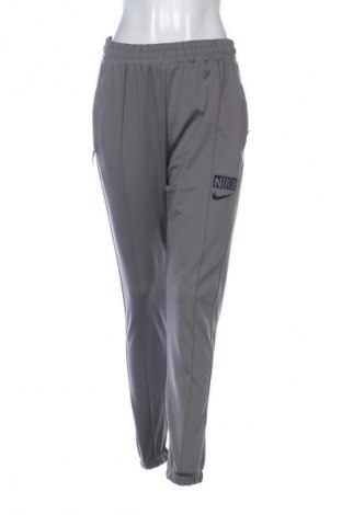 Γυναικείο αθλητικό παντελόνι Nike, Μέγεθος M, Χρώμα Γκρί, Τιμή 22,99 €