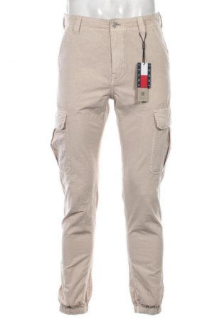 Męskie spodnie Tommy Jeans, Rozmiar M, Kolor Beżowy, Cena 452,99 zł