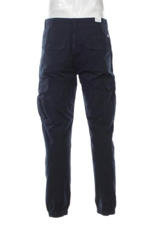 Męskie spodnie Tommy Jeans, Rozmiar M, Kolor Niebieski, Cena 318,99 zł