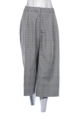 Damskie spodnie Reserved, Rozmiar L, Kolor Kolorowy, Cena 80,99 zł