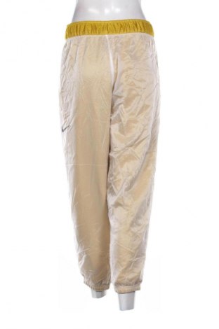 Damskie spodnie sportowe Nike, Rozmiar S, Kolor Kolorowy, Cena 110,99 zł