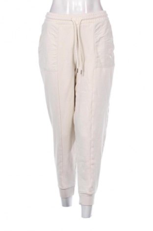 Γυναικείο αθλητικό παντελόνι PUMA, Μέγεθος S, Χρώμα  Μπέζ, Τιμή 25,99 €
