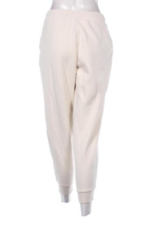 Γυναικείο αθλητικό παντελόνι PUMA, Μέγεθος S, Χρώμα  Μπέζ, Τιμή 25,99 €