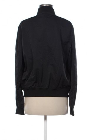 Γυναικείο μπουφάν Tommy Jeans, Μέγεθος L, Χρώμα Μαύρο, Τιμή 147,99 €