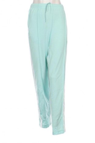 Damskie spodnie sportowe Adidas Originals, Rozmiar L, Kolor Niebieski, Cena 200,99 zł