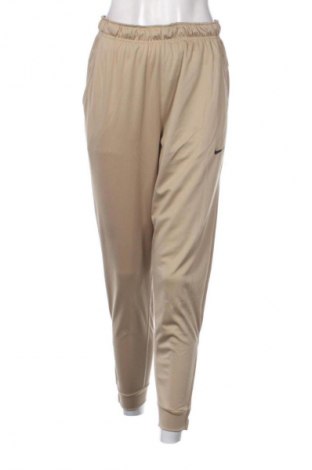 Dámské tepláky Nike, Velikost S, Barva Béžová, Cena  1 149,00 Kč