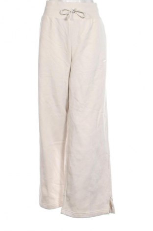 Dámské tepláky Nike, Velikost XL, Barva Béžová, Cena  1 429,00 Kč