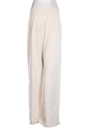 Dámské tepláky Nike, Velikost XL, Barva Béžová, Cena  1 429,00 Kč