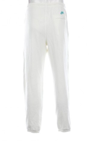 Męskie spodnie sportowe Nike, Rozmiar L, Kolor ecru, Cena 129,99 zł