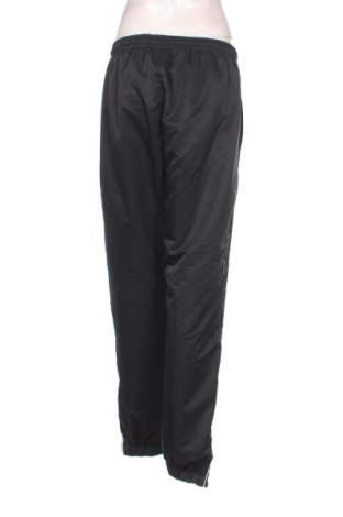 Дамско спортно долнище Lacoste, Размер L, Цвят Син, Цена 33,23 €