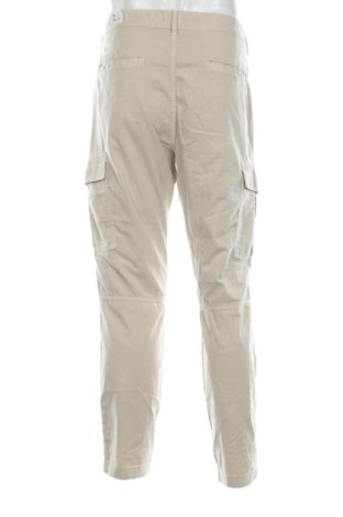 Pánske nohavice  Tommy Jeans, Veľkosť L, Farba Béžová, Cena  103,95 €
