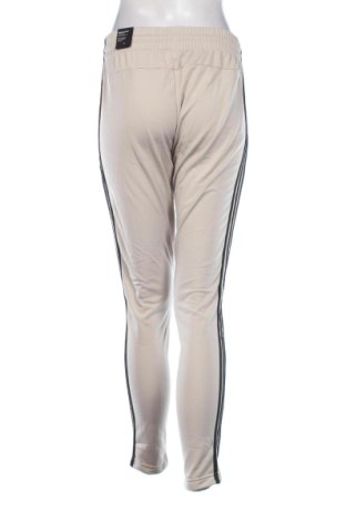 Damskie spodnie sportowe Adidas, Rozmiar M, Kolor Beżowy, Cena 250,99 zł
