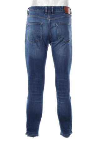 Męskie jeansy River Island, Rozmiar M, Kolor Niebieski, Cena 133,96 zł