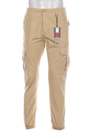 Męskie spodnie Tommy Jeans, Rozmiar M, Kolor Beżowy, Cena 493,99 zł
