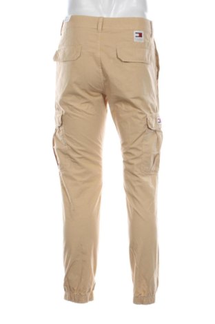Męskie spodnie Tommy Jeans, Rozmiar M, Kolor Beżowy, Cena 493,99 zł