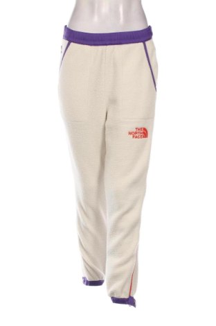 Damskie spodnie sportowe The North Face, Rozmiar S, Kolor ecru, Cena 187,55 zł