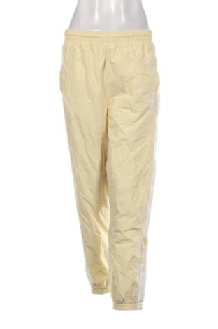 Damskie spodnie sportowe Adidas, Rozmiar L, Kolor Żółty, Cena 110,99 zł