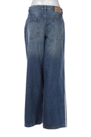 Damskie jeansy Adidas Originals, Rozmiar XL, Kolor Niebieski, Cena 471,55 zł