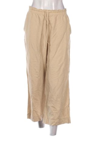 Damskie spodnie H&M, Rozmiar M, Kolor Beżowy, Cena 80,38 zł
