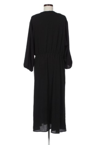 Latzkleid Paprika, Größe L, Farbe Schwarz, Preis 31,99 €
