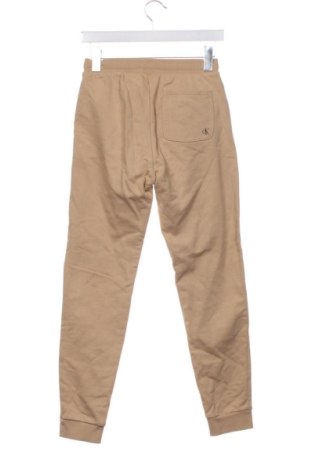 Детско спортно долнище Calvin Klein Jeans, Размер 12-13y/ 158-164 см, Цвят Бежов, Цена 17,00 €