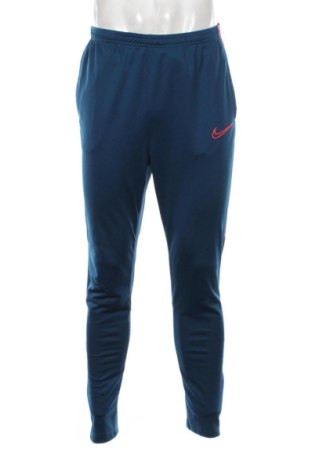 Męskie spodnie sportowe Nike, Rozmiar L, Kolor Niebieski, Cena 131,57 zł