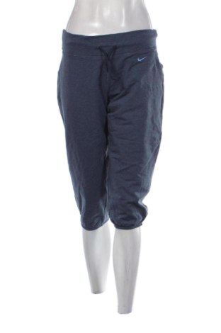 Damskie spodnie sportowe Nike, Rozmiar L, Kolor Niebieski, Cena 112,99 zł, #136792512