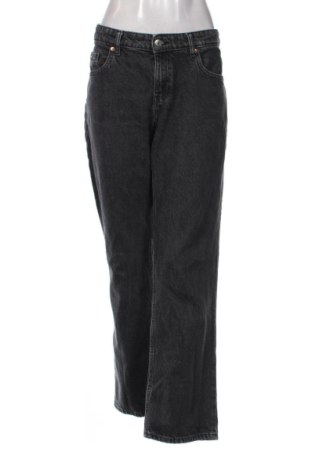 Damskie jeansy H&M, Rozmiar L, Kolor Czarny, Cena 59,27 zł, #137338458