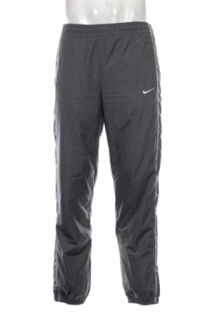 Ανδρικό αθλητικό παντελόνι Nike, Μέγεθος S, Χρώμα Γκρί, Τιμή 33,00 €, #137586179