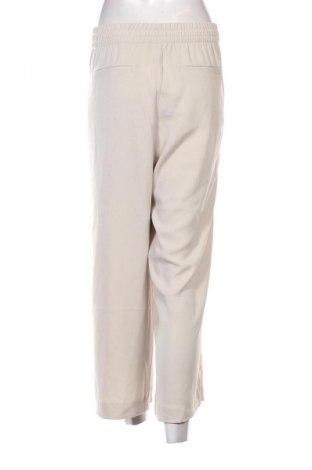 Damskie spodnie H&M, Rozmiar L, Kolor ecru, Cena 24,99 zł