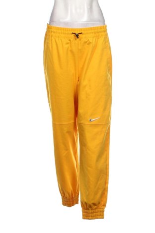 Damskie spodnie sportowe Nike, Rozmiar M, Kolor Żółty, Cena 217,18 zł, #137772651