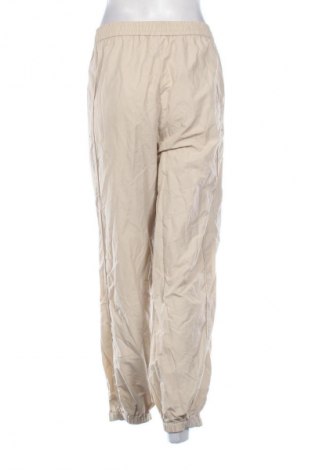 Дамско спортно долнище Weekday, Размер M, Цвят Бежов, Цена 17,03 €