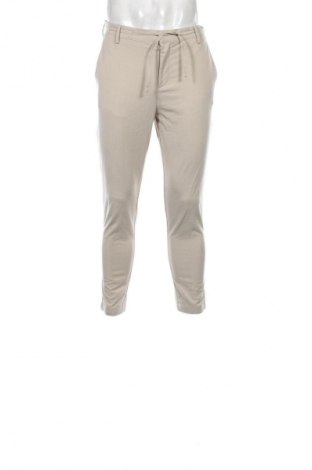 Męskie spodnie Celio, Rozmiar M, Kolor Beżowy, Cena 22,99 zł
