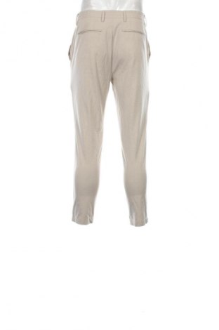 Męskie spodnie Celio, Rozmiar M, Kolor Beżowy, Cena 22,99 zł