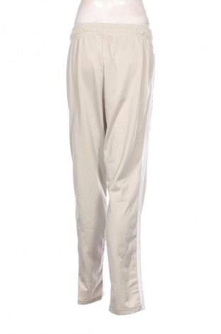 Damskie spodnie sportowe Adidas, Rozmiar XL, Kolor Beżowy, Cena 82,99 zł