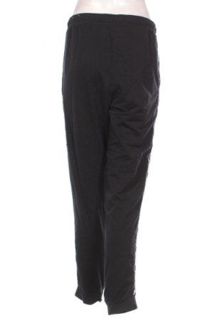 Γυναικείο αθλητικό παντελόνι PUMA, Μέγεθος L, Χρώμα Μαύρο, Τιμή 8,85 €