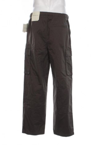 Pánské kalhoty  Calvin Klein Jeans, Velikost L, Barva Šedá, Cena  899,00 Kč